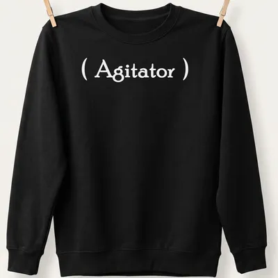 Minimalist Agitator t-shirt with bold white lettering on a simple background — printed on a unisex sweatshirt