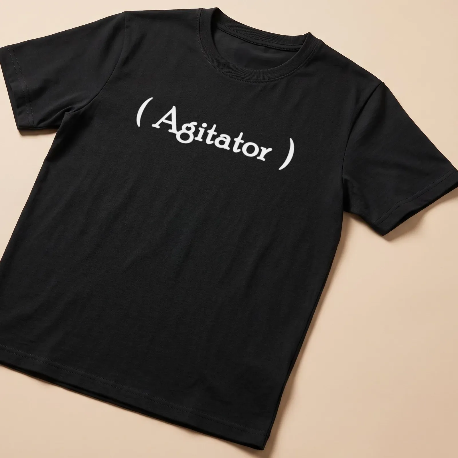 Minimalist Agitator t-shirt with bold white lettering on a simple background — printed on a unisex t-shirt