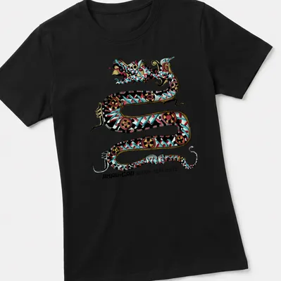 Intricate Maya-inspired serpent design with colorful elements and bold text — printed on a women's shirt