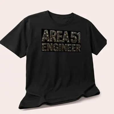 Industrial steampunk print with mechanical letters saying AREA 51 ENGINEER — printed on a unisex t-shirt (angled view)