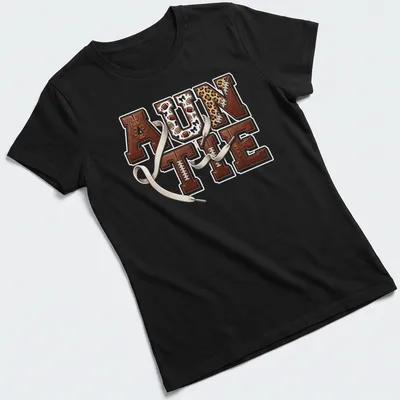 Retro sports design with 'AUNTIE' and football elements in warm colors. — printed on a women's shirt