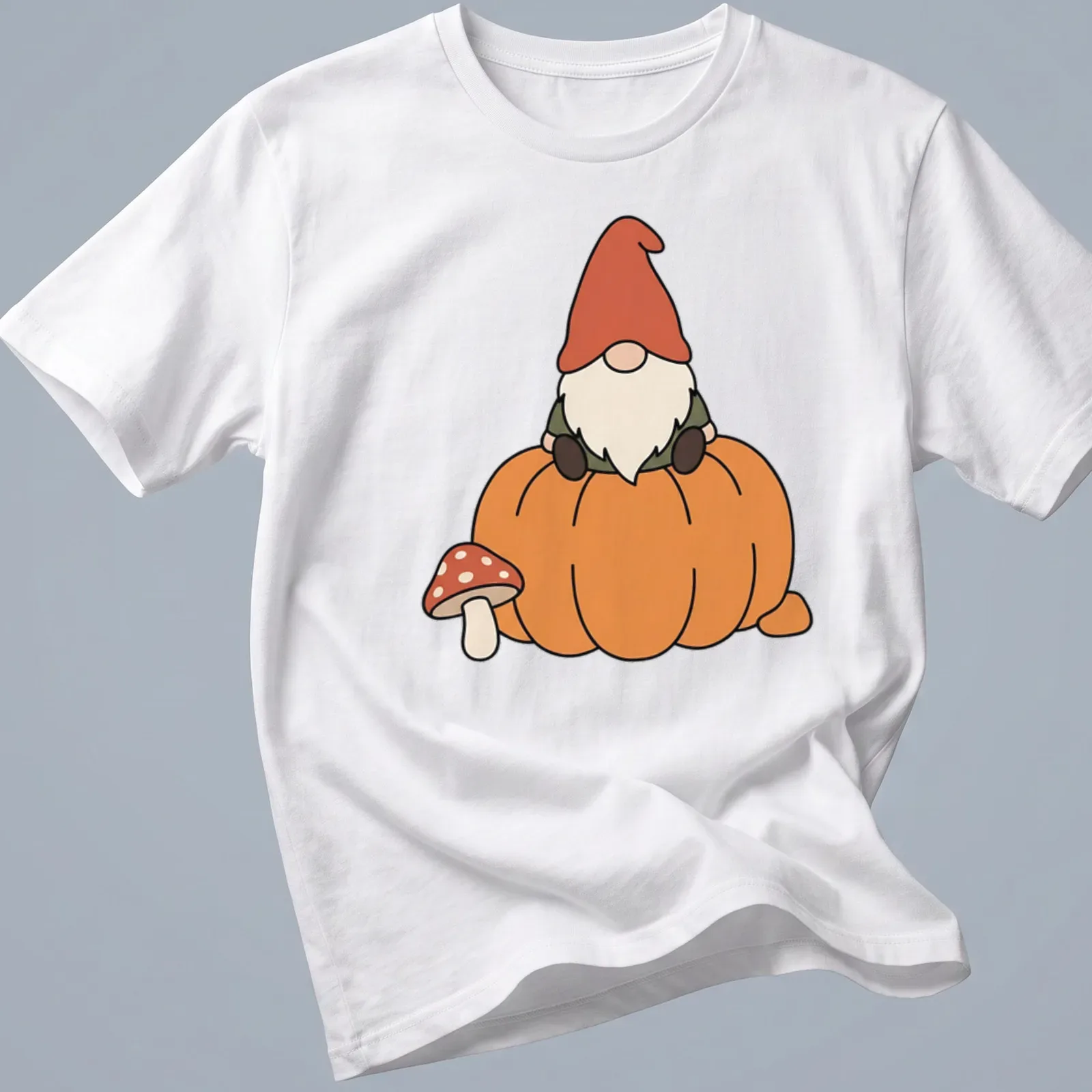 Kawaii gnome sitting on a pumpkin with a mushroom, featuring autumn colors — printed on a unisex t-shirt