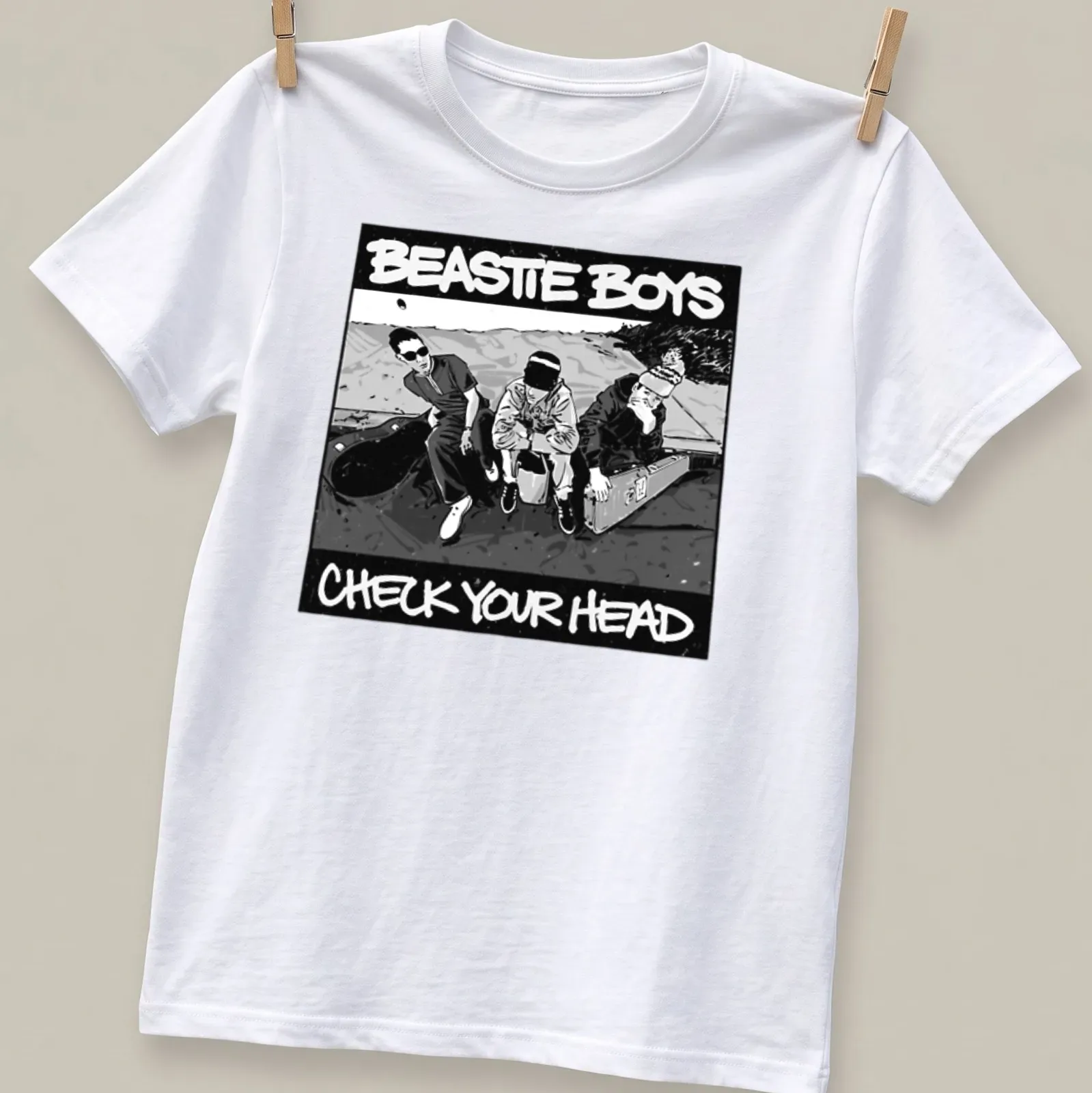 Black and white illustration of three men with Beastie Boys text — printed on a unisex t-shirt
