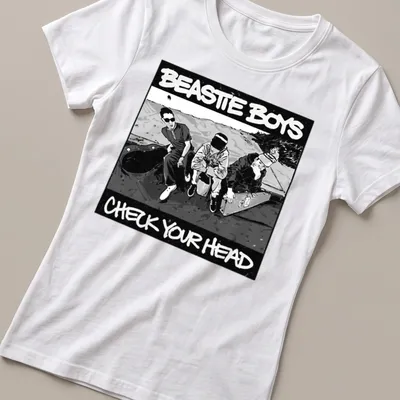 Black and white illustration of three men with Beastie Boys text — printed on a women's shirt