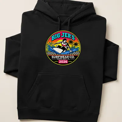 Vibrant retro print of a surfer riding a wave with text Big Jer's Surfwear Co. — printed on a unisex hoodie
