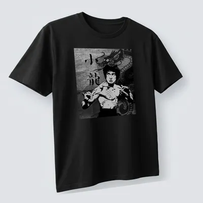 Comic-style shirt featuring Bruce Lee and the text 小龍 in black, white, and gray. — printed on a unisex t-shirt (angled view)