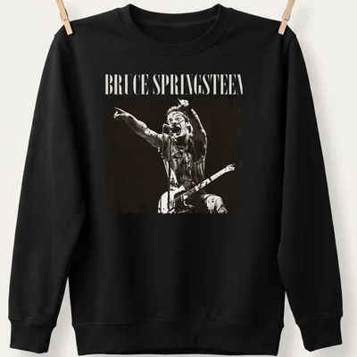 Vintage distressed t-shirt featuring Bruce Springsteen in black and cream typography — printed on a unisex sweatshirt