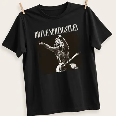 Vintage distressed t-shirt featuring Bruce Springsteen in black and cream typography