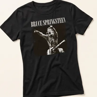 Vintage distressed t-shirt featuring Bruce Springsteen in black and cream typography — printed on a women's shirt