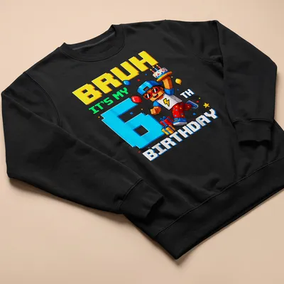 Colorful pixel art t-shirt featuring a birthday boy character and text for a 6th birthday — printed on a unisex sweatshirt