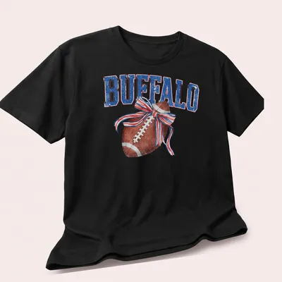 Vintage distressed t-shirt featuring a football with a bow and the text BUFFALO — printed on a unisex t-shirt (angled view)