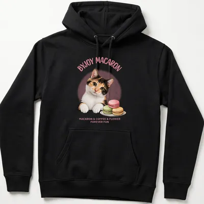 Cute calico cat surrounded by macarons and flowers with playful text — printed on a unisex hoodie