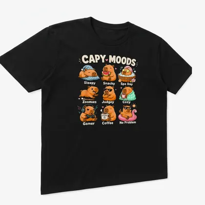 Cute cartoon capybaras expressing various moods with colorful text — printed on a unisex t-shirt (angled view)
