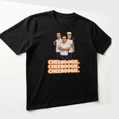 Cartoon illustration of three male chefs with Cheeboogie text in orange, black, and white — printed on a unisex t-shirt (angled view)