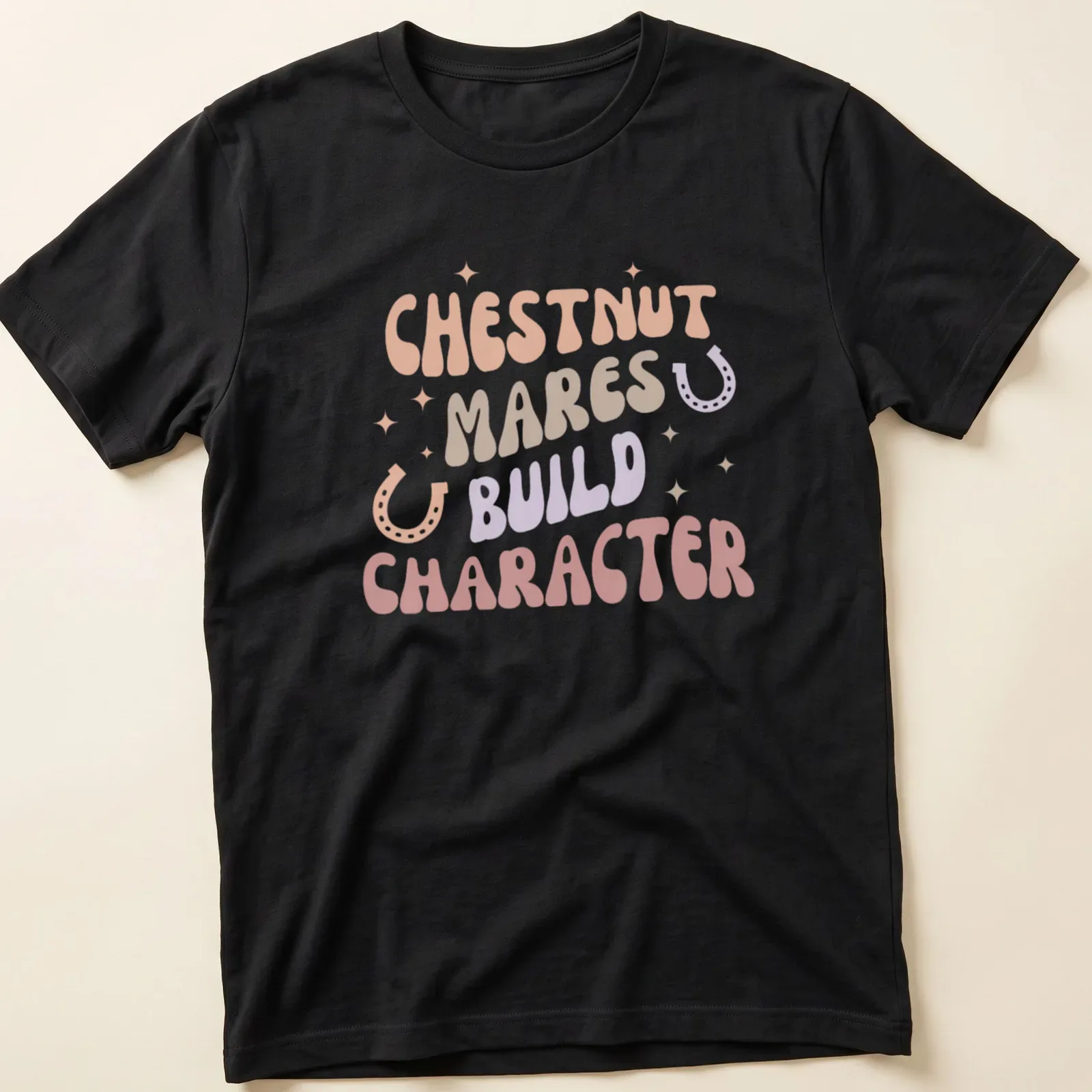 Playful typography design featuring chestnut mares with colorful lettering — printed on a unisex t-shirt