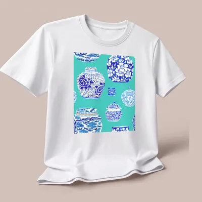 Watercolor print of ginger jars in teal, blue, and white on a — printed on a unisex t-shirt (angled view)