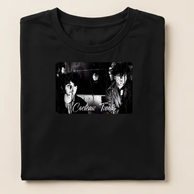 Black and white design featuring Cocteau Twins band name and photography — printed on a women's shirt
