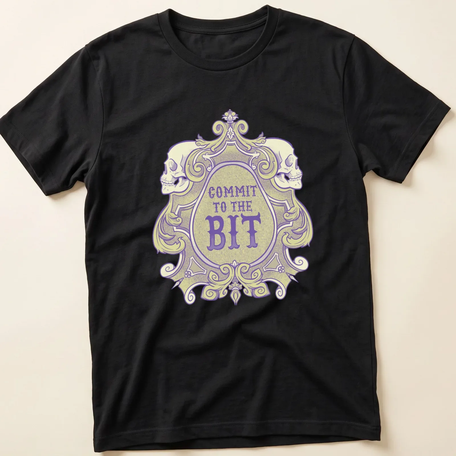 Ornate vintage skull graphic with 'COMMIT TO THE BIT' in bold lettering — printed on a unisex t-shirt