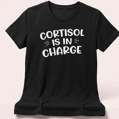 Funny cartoon print of the cortisol molecule with text about stress management — printed on a women's shirt