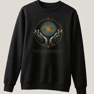 Geometric hands holding a galaxy with inspirational text about creating your reality. — printed on a unisex sweatshirt