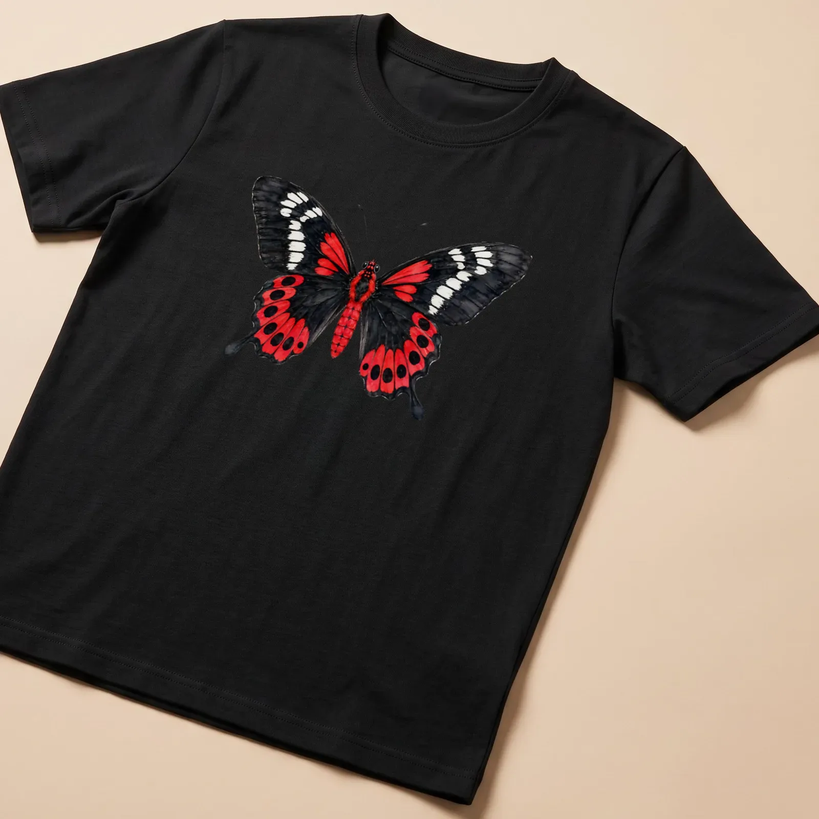 Watercolor illustration of a crimson rose butterfly in red, black, and white — printed on a unisex t-shirt