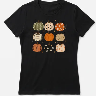 Boho illustrated T-shirt featuring decorative pumpkins in autumn colors — printed on a women's shirt