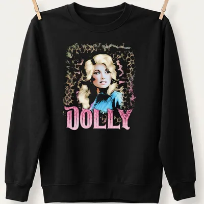 Dolly Parton vintage glam tee featuring leopard print design and bold lettering. — printed on a unisex sweatshirt