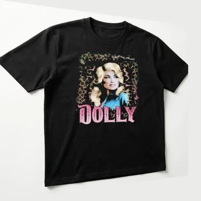 Dolly Parton vintage glam tee featuring leopard print design and bold lettering. — printed on a unisex t-shirt (angled view)