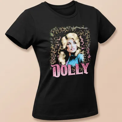 Dolly Parton vintage glam tee featuring leopard print design and bold lettering. — printed on a women's shirt