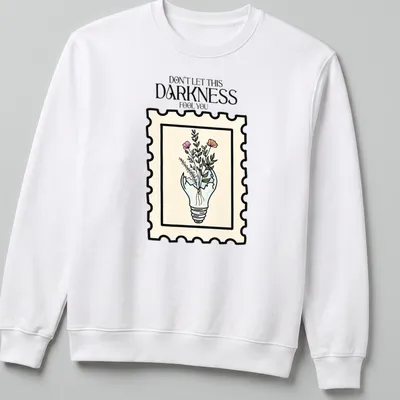 Illustrative design of a light bulb with flowers and text in pastel colors — printed on a unisex sweatshirt