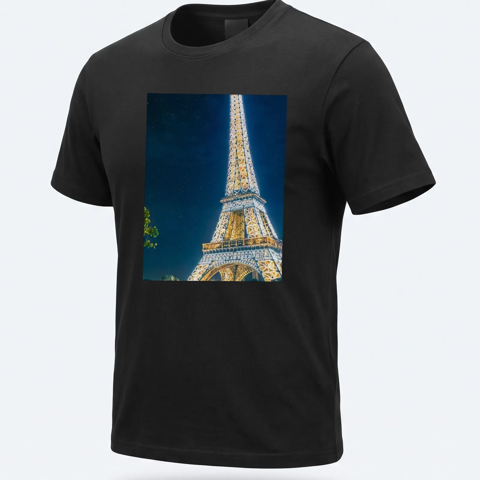 Photographic Eiffel Tower illuminated at night in gold, blue, and black — printed on a unisex t-shirt