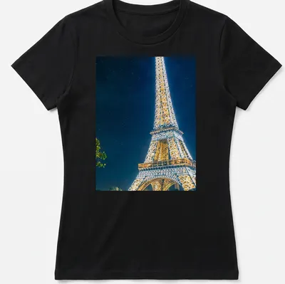 Photographic Eiffel Tower illuminated at night in gold, blue, and black — printed on a women's shirt