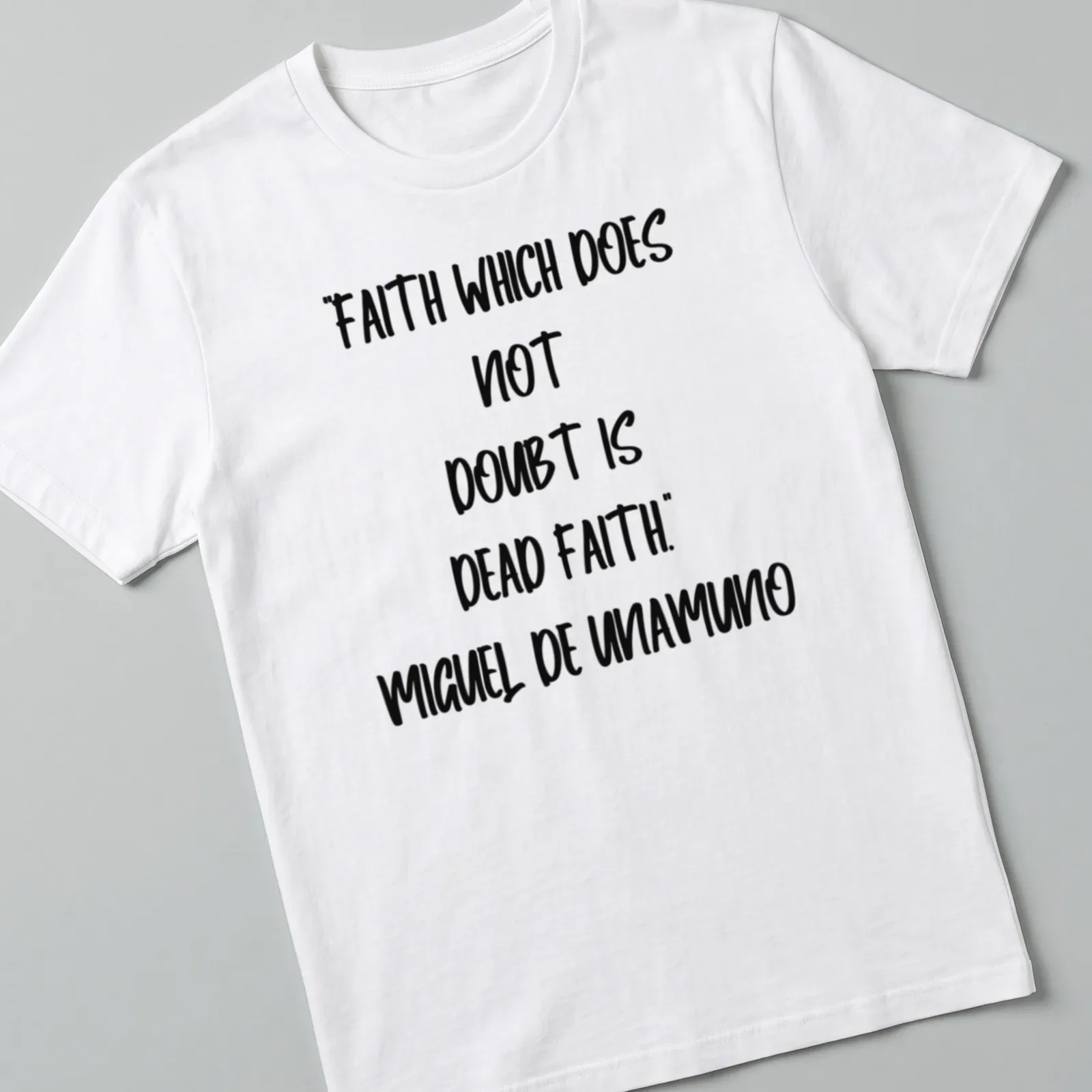 Bold handwritten Miguel De Unamuno quote on faith in black and white — printed on a unisex t-shirt