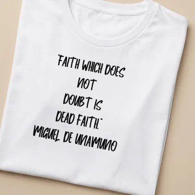 Bold handwritten Miguel De Unamuno quote on faith in black and white — printed on a women's shirt