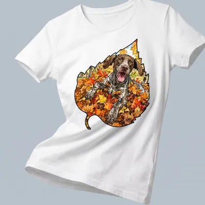 Realistic print of a German Shorthaired Pointer playing in colorful autumn leaves — printed on a women's shirt