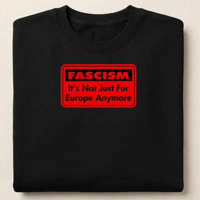 Bold typography shirt featuring text about fascism in red and black — printed on a unisex sweatshirt