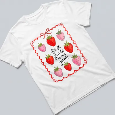 Whimsical illustration of strawberries with text 'first grade is my jam' in red and green