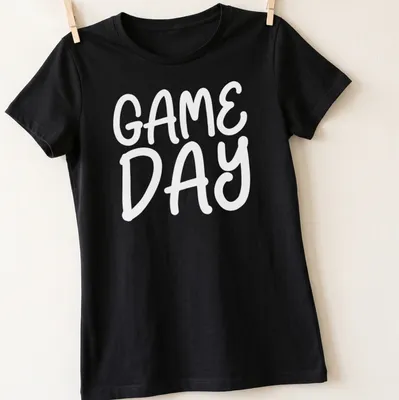 Bold graphic t-shirt for sports moms featuring basketball and soccer themes — printed on a women's shirt