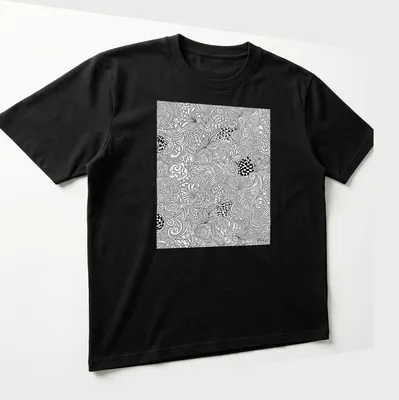 Intricate black and white line art decorative pattern — printed on a unisex t-shirt (angled view)