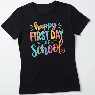 Colorful text reads happy FIRST DAY of SCHOOL on a vibrant teacher — printed on a women's shirt