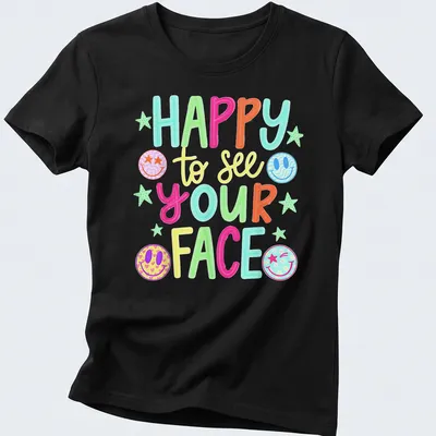 Vibrant T-shirt with colorful smiley faces and playful text — printed on a women's shirt