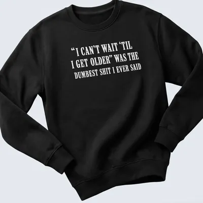 Sarcastic typography shirt about the irony of growing older. — printed on a unisex sweatshirt