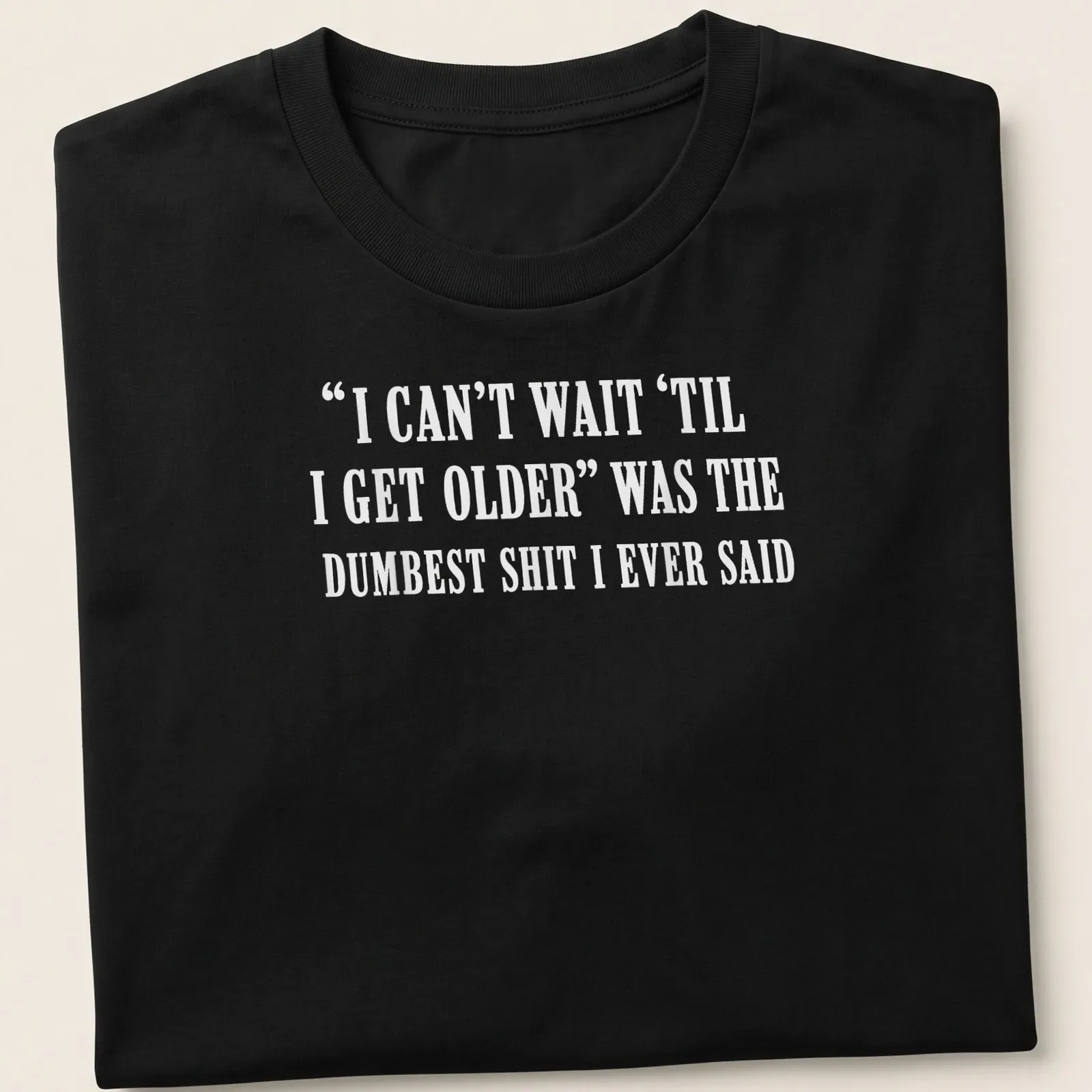 Sarcastic typography shirt about the irony of growing older. — printed on a unisex t-shirt