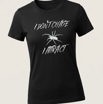 Minimalist spider design with bold text reading 'I Don’t Chase I Attract' in black and white. — printed on a women's shirt