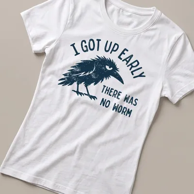 Vintage distressed t-shirt with a black bird and humorous text about early mornings. — printed on a women's shirt