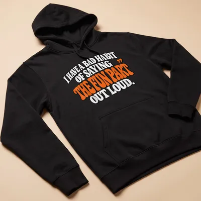 Bold retro text design stating I HAVE A BAD HABIT OF SAYING 'THE FUN PART' OUT LOUD in black and orange. — printed on a unisex hoodie