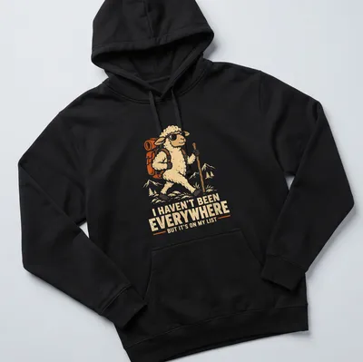 Vintage-style t-shirt with hiking sheep and travel-themed text — printed on a unisex hoodie