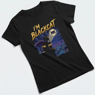 Cartoon print of a superhero cat on a rooftop with bold colors — printed on a women's shirt