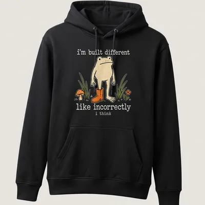 Playful cartoon frog with humorous text about being different — printed on a unisex hoodie