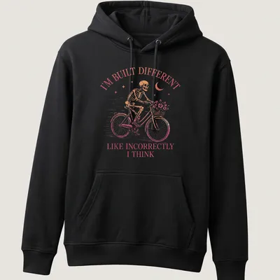 Vintage skeleton riding a bicycle with humorous text in pink and brown — printed on a unisex hoodie